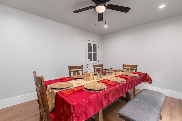 dining room featuring ceiling fan, wood-type flooring, and ornamental molding