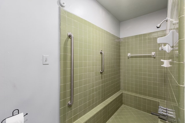 bathroom with tiled shower