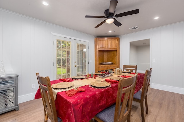 dining area with ceiling fan, light hardwood / wood-style flooring, crown molding, and french doors