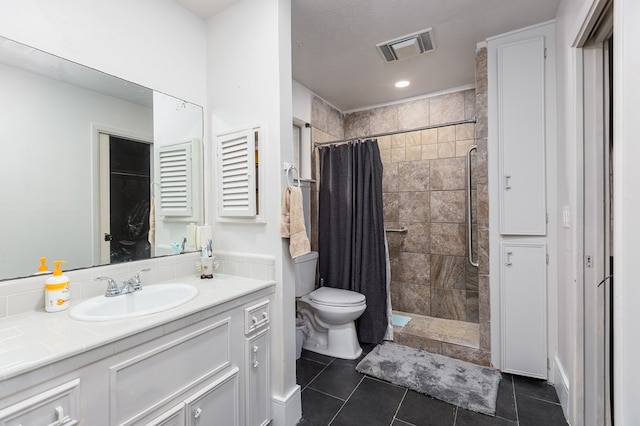 bathroom featuring a shower with curtain, vanity, and tile patterned floors