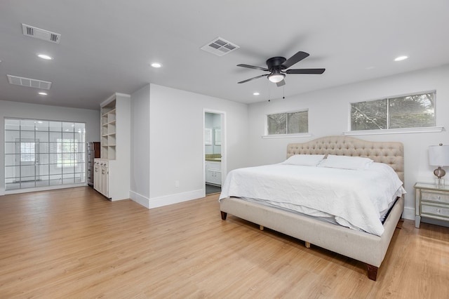 bedroom with ensuite bath, ceiling fan, and light wood-type flooring