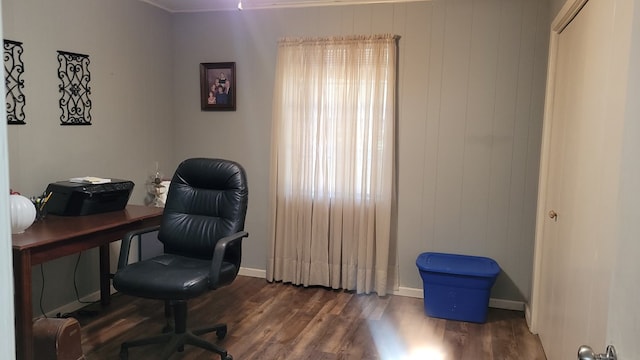 office with ornamental molding and dark wood-type flooring