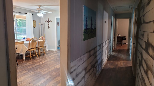 corridor with wood-type flooring