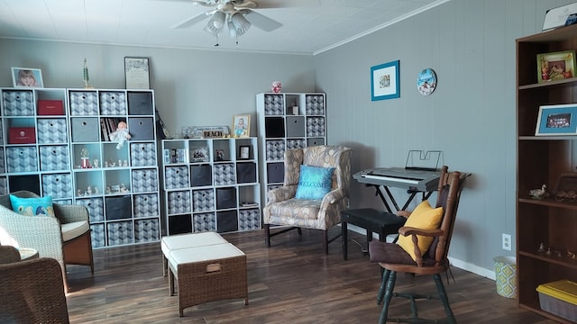 sitting room with dark hardwood / wood-style floors, ceiling fan, and ornamental molding