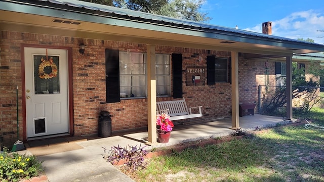 property entrance with a patio