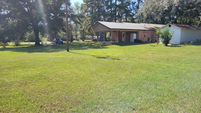 view of yard featuring covered porch