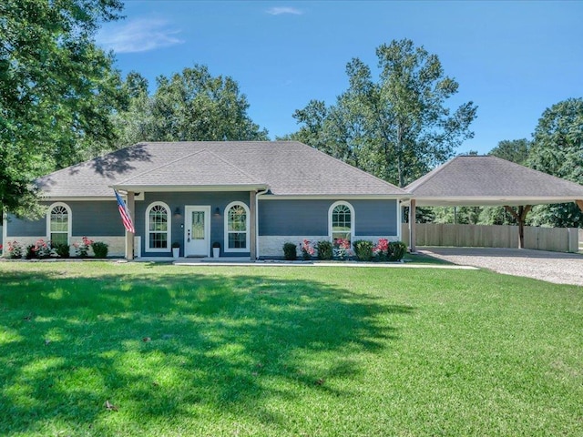 1207 Old Ewing Rd, Lufkin, TX 75901 - ranch-style house with a carport and gravel driveway