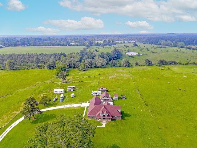 birds eye view of property with a rural view