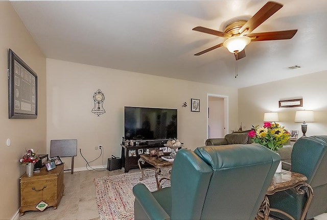 living room featuring ceiling fan and light tile patterned flooring