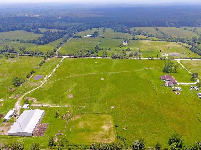 birds eye view of property featuring a rural view