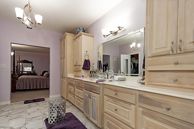 bathroom with vanity and a chandelier