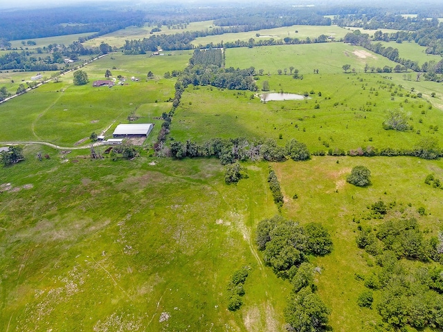 birds eye view of property with a rural view