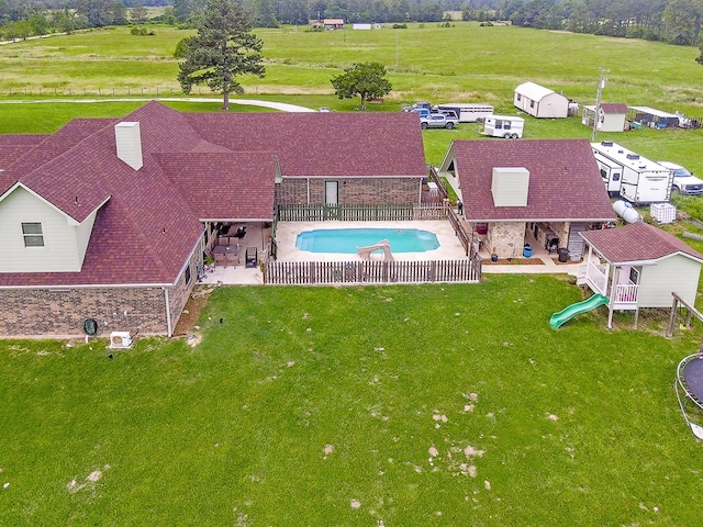 birds eye view of property featuring a rural view