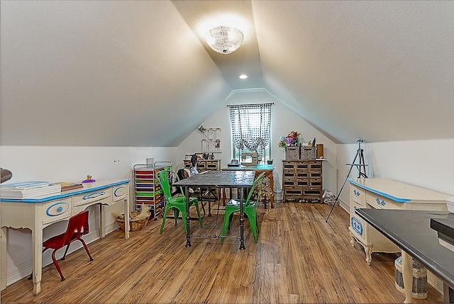 game room featuring wood-type flooring and lofted ceiling