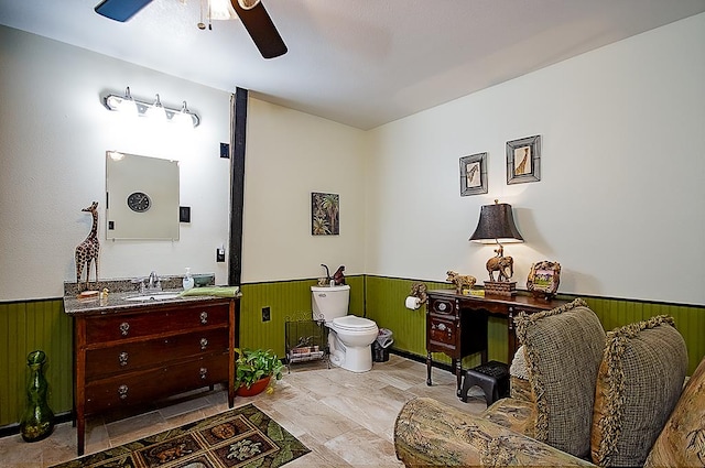 bathroom with ceiling fan, vanity, and toilet