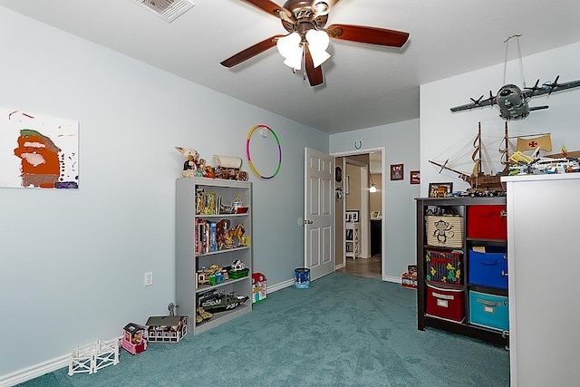 playroom featuring carpet floors and ceiling fan