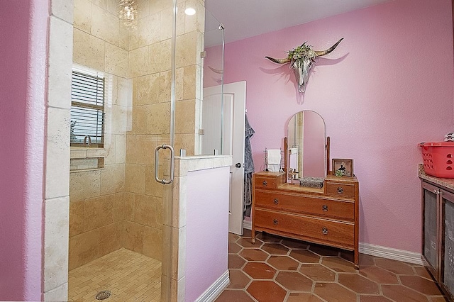 bathroom featuring tile patterned flooring and an enclosed shower