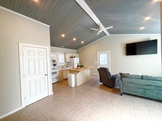 living room with wood ceiling, ceiling fan, and vaulted ceiling