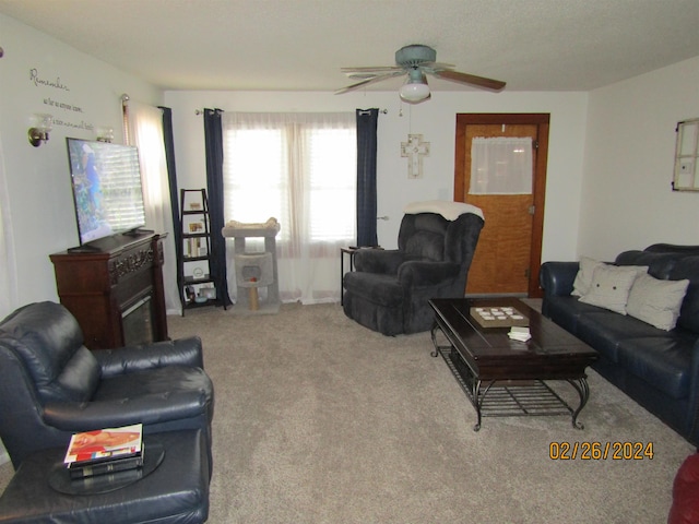 living room with carpet flooring and ceiling fan