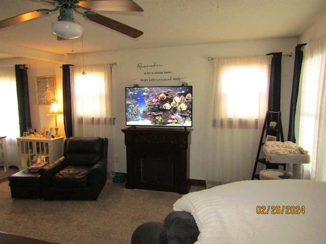 bedroom with carpet flooring, multiple windows, and ceiling fan