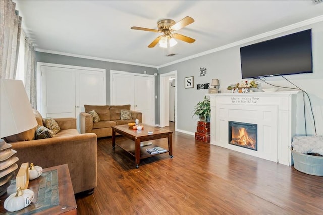 living room featuring crown molding and wood-type flooring