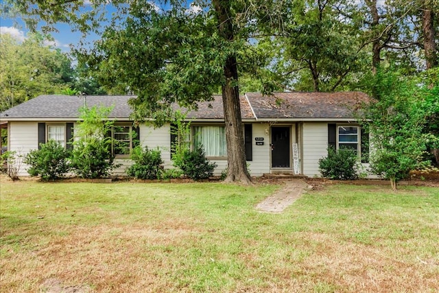 ranch-style house with a front lawn