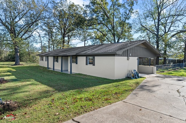 view of property exterior with a lawn