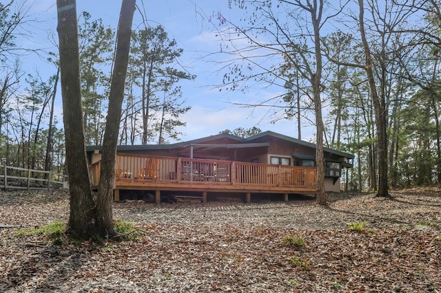 back of property with a wooden deck