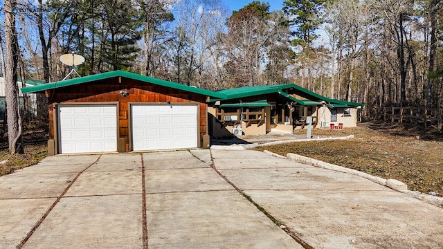 exterior space featuring a garage and an outdoor structure