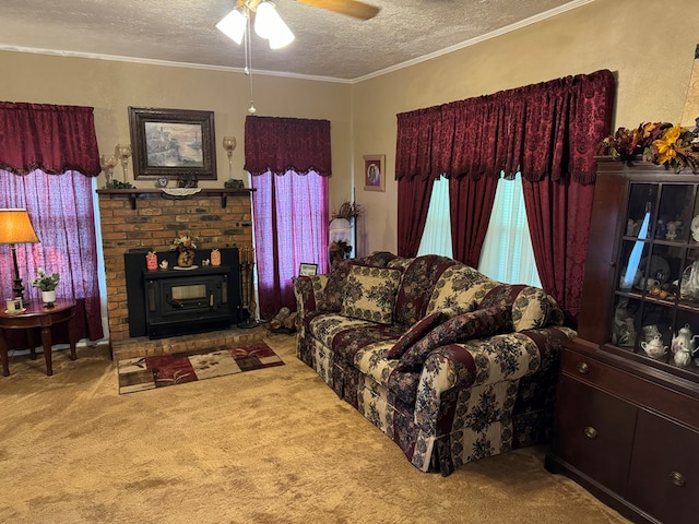 living room featuring a textured ceiling, ornamental molding, a ceiling fan, and carpet floors