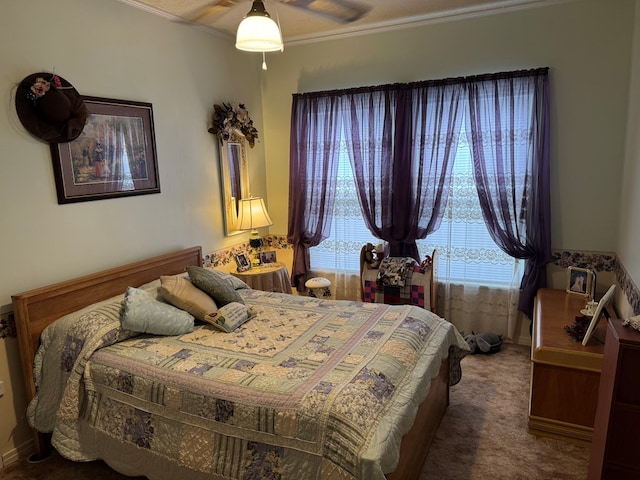 carpeted bedroom featuring ornamental molding and multiple windows