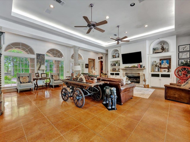 2102 Brentwood Dr, Lufkin, TX 75901 - living room featuring a raised ceiling, light tile patterned floors, ceiling fan, built in features, and recessed lighting