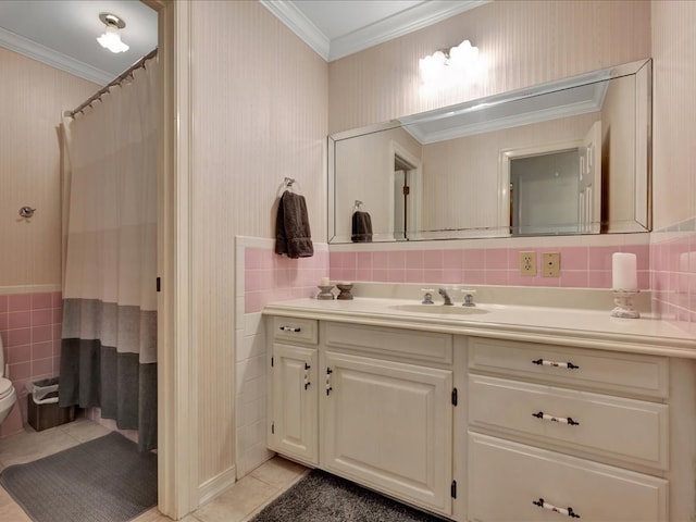 full bathroom featuring crown molding, vanity, tile walls, toilet, and tile patterned flooring