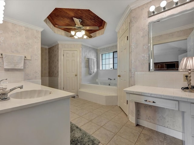 bathroom featuring wallpapered walls, a sink, tile patterned flooring, and a tray ceiling