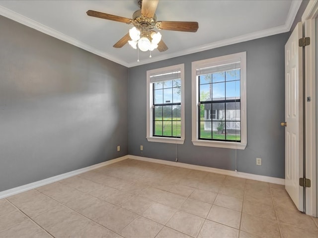 empty room featuring ceiling fan, baseboards, ornamental molding, and light tile patterned flooring