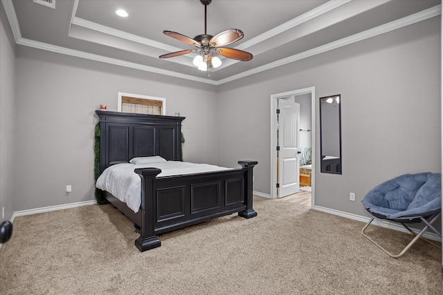 2607 Old Union Rd, Lufkin, TX 75904 - bedroom with a tray ceiling, light colored carpet, baseboards, ornamental molding, and ensuite bathroom