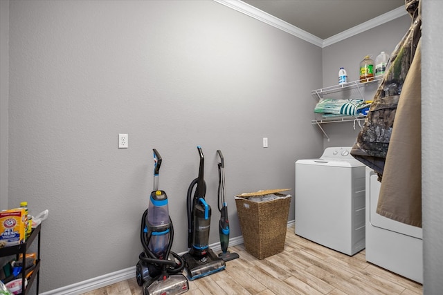 2607 Old Union Rd, Lufkin, TX 75904 - laundry area featuring washer and dryer, crown molding, wood finished floors, and baseboards