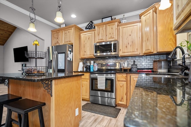 2607 Old Union Rd, Lufkin, TX 75904 - kitchen featuring appliances with stainless steel finishes, a sink, crown molding, light wood-style flooring, and light brown cabinets