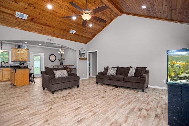 2607 Old Union Rd, Lufkin, TX 75904 - living room with wooden ceiling with exposed beams, light wood finished floors, arched walkways, recessed lighting, and baseboards