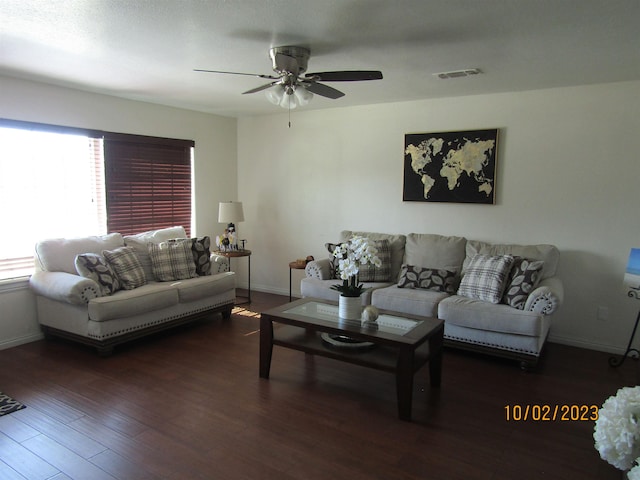 living room with ceiling fan and dark hardwood / wood-style floors