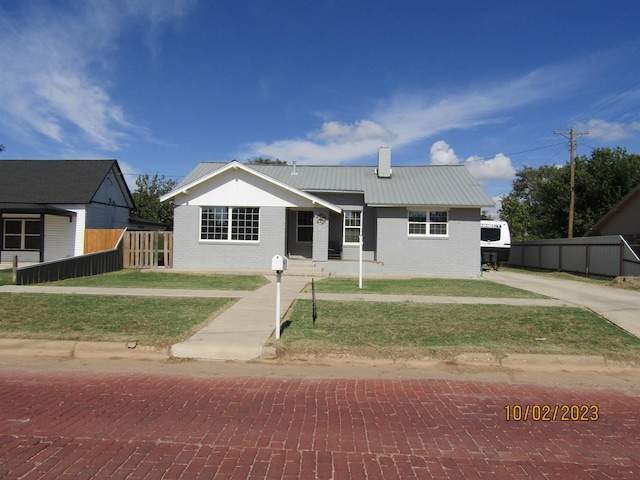 view of front of home with a front lawn