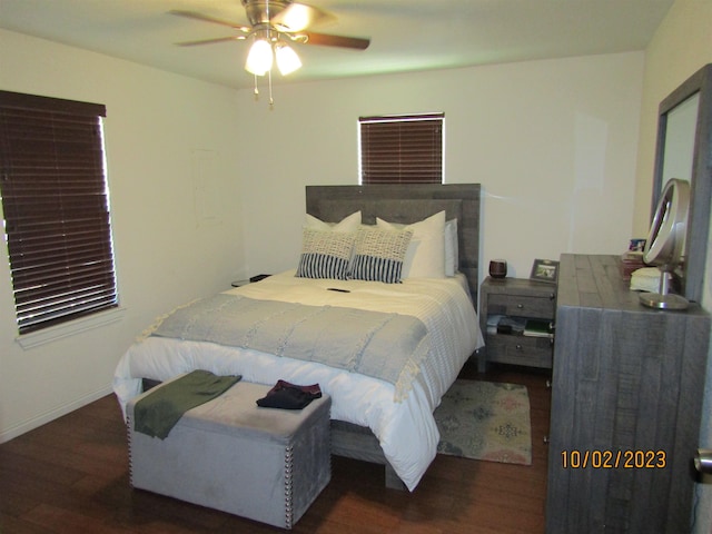 bedroom featuring ceiling fan and dark wood-type flooring