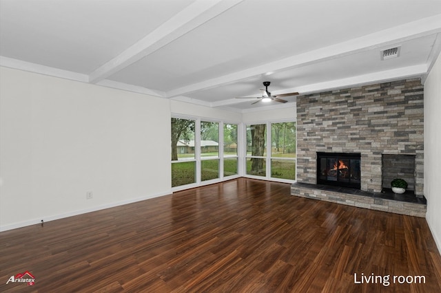 unfurnished living room with ceiling fan, visible vents, beam ceiling, and wood finished floors