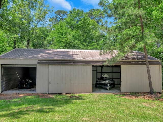 view of outdoor structure featuring a yard