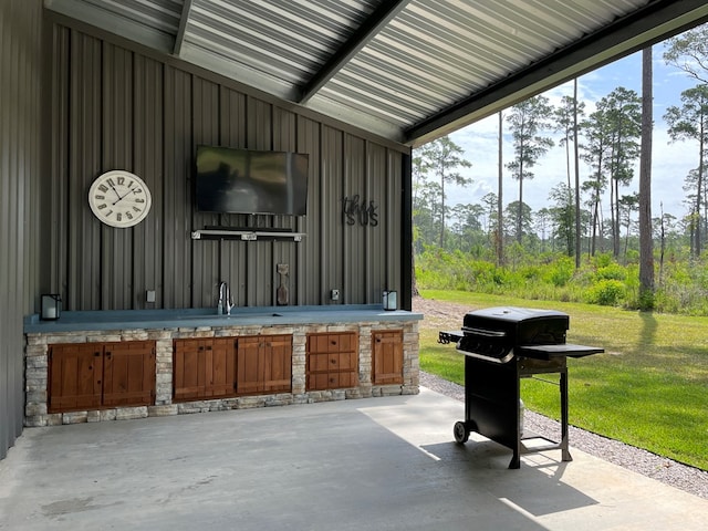 view of patio / terrace featuring grilling area and sink