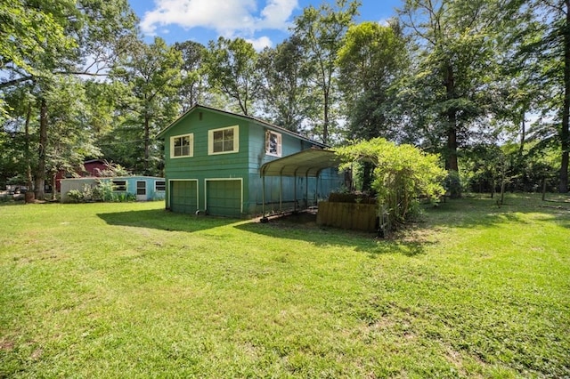 390 County Road 076, Jasper, TX 75951 - view of grassy yard with a garage