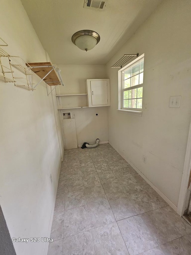 laundry room featuring laundry area, hookup for a washing machine, baseboards, hookup for an electric dryer, and visible vents