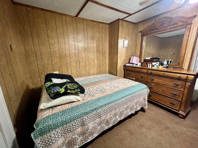 carpeted bedroom with wood walls