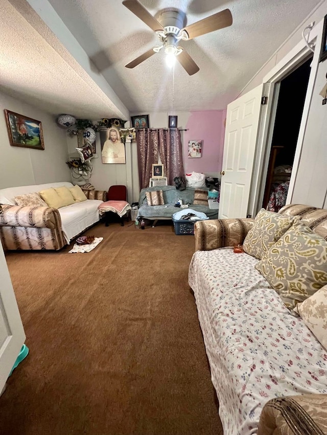 living room featuring carpet, a textured ceiling, and ceiling fan