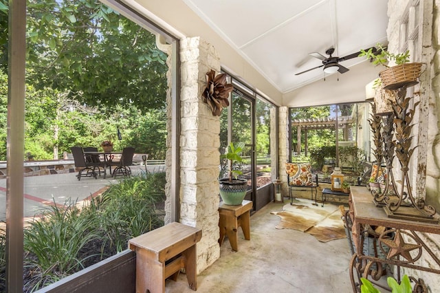 sunroom / solarium featuring ceiling fan and vaulted ceiling